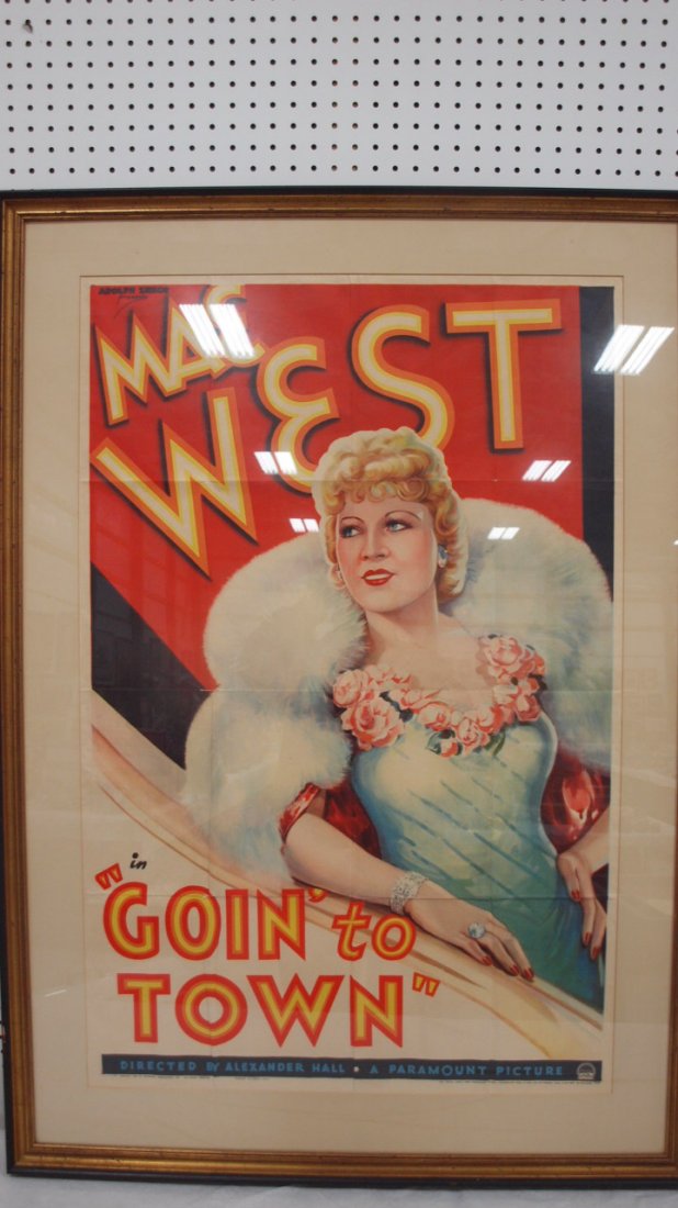Mae West in "Goin to Town" original movie poster dated: Mae West in "Goin to Town" original movie poster dated 1935 by Paramount Pictures, 27"x41", I believe the poster is original, we are unable to determine if it is glued down or not. Where the folds are