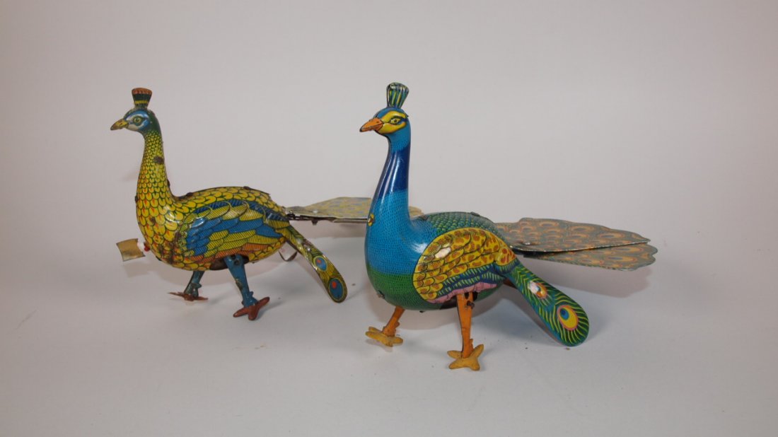 Tin lithograph pair of wind up peacock toys: Tin lithograph pair of wind up peacock toys