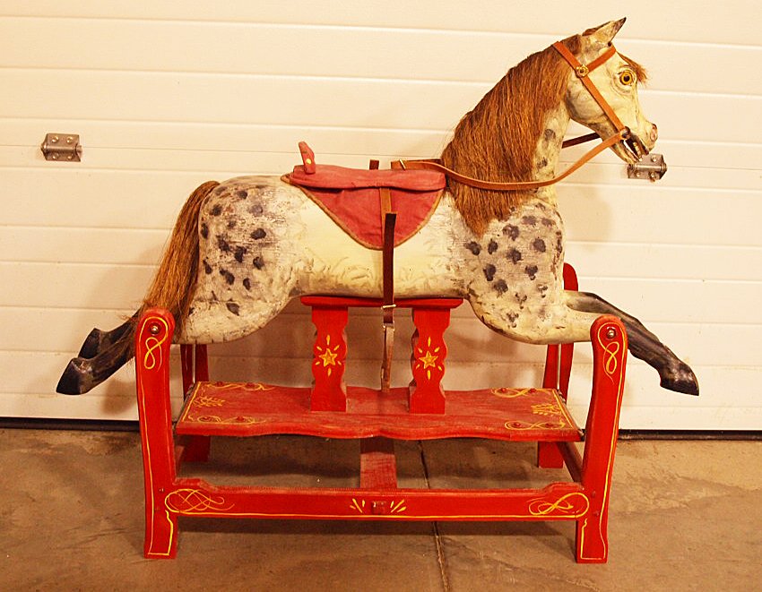 Carved & painted wooden rocking horse on swing frame: Carved & painted wooden rocking horse on swing frame