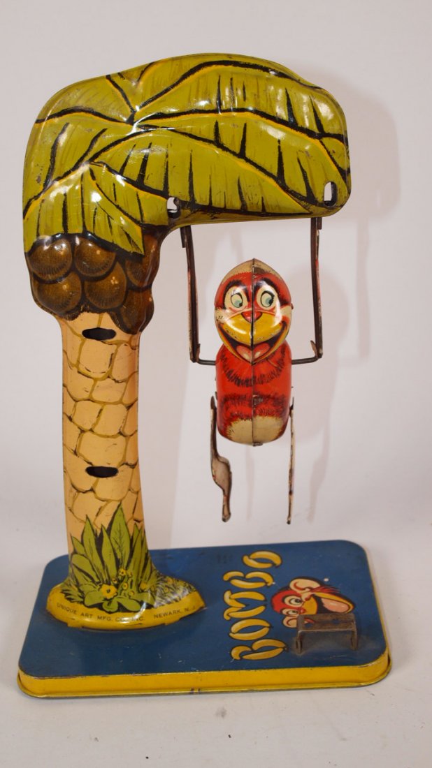 Unique Art Bombo tin litho wind up swinging monkey: Unique Art Bombo tin litho wind up swinging monkey