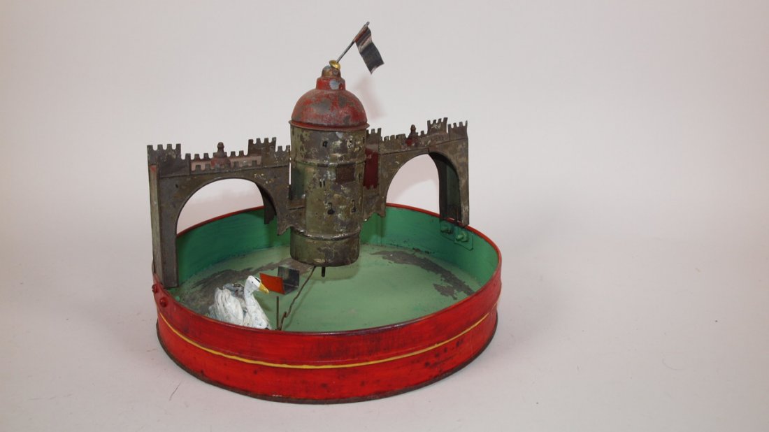Tin wind up swan pond toy, some paint loss: Tin wind up swan pond toy, some paint loss