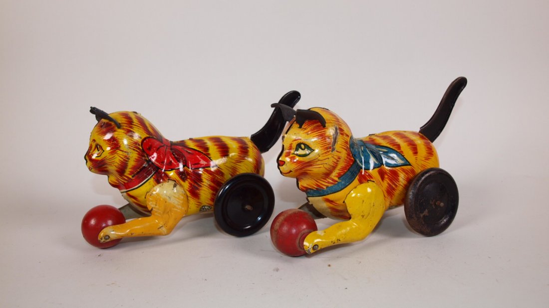 Marx tin litho cat with ball wind up pair of toys, one: Marx tin litho cat with ball wind up pair of toys, one with red ribbon the other with blue