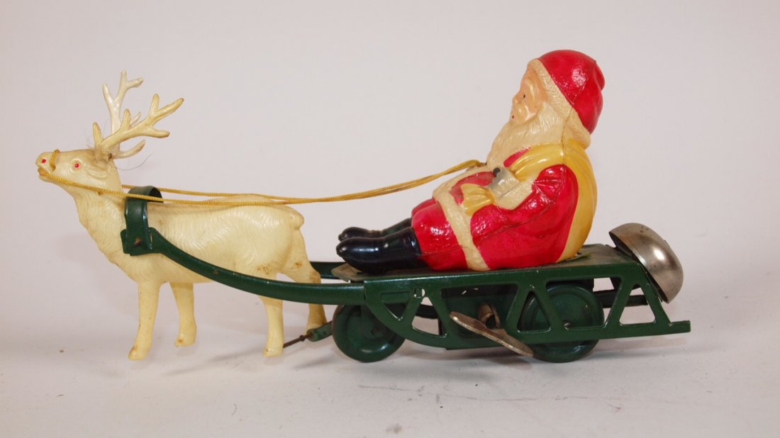 Celluloid Santa & reindeer on tin litho sled wind up: Celluloid Santa & reindeer on tin litho sled wind up bell toy