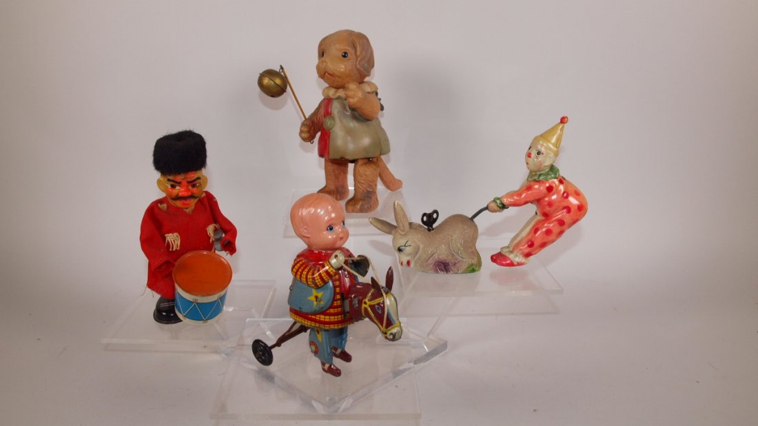 Celluloid and tin lot of 4 wind up toys: Celluloid and tin lot of 4 wind up toys