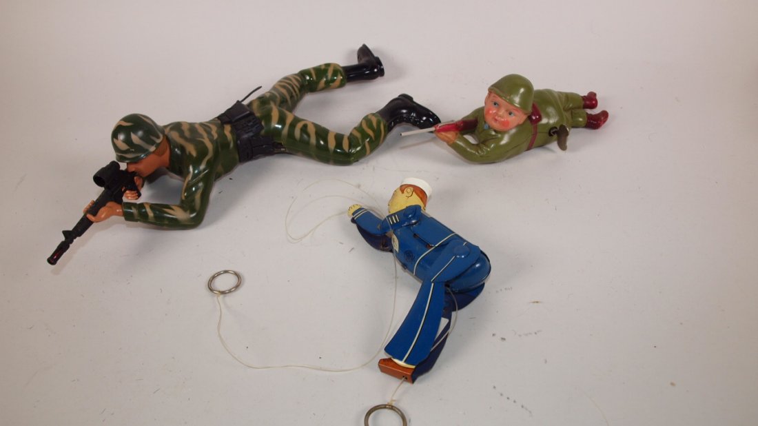 Linemar tin litho Navy Sailor string toy, Occupied: Linemar tin litho Navy Sailor string toy, Occupied Japan celluloid soldier wind up and battery operated soldier in camo