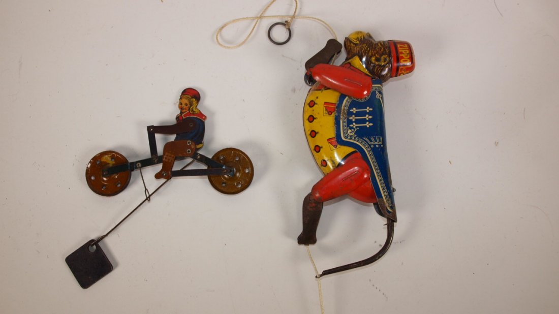 Tin litho Buster Brown string toy and Zippo climbing: Tin litho Buster Brown string toy and Zippo climbing monkey (wear) string toy
