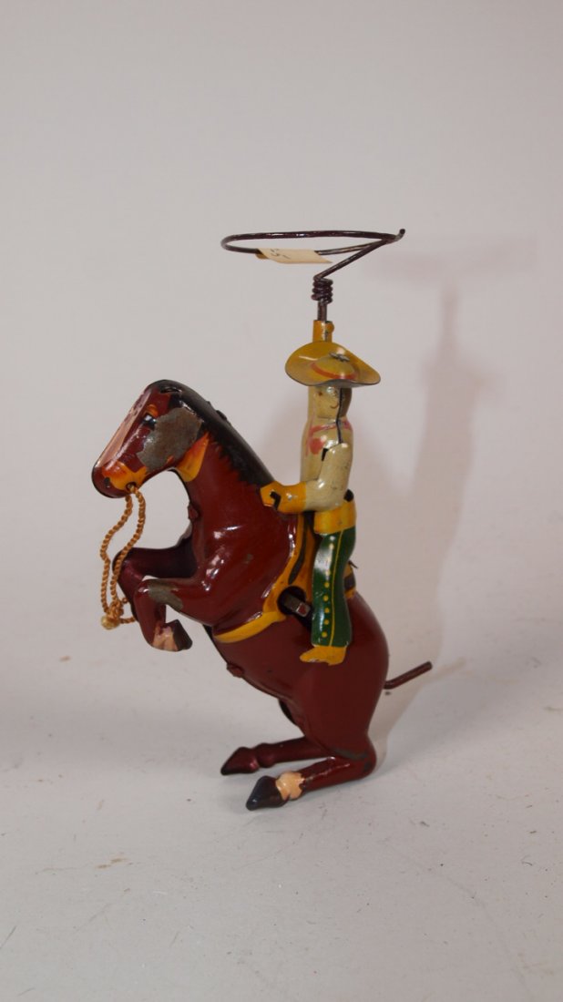 Tin litho cowboy on horse with lasso wind up toy, 4: Tin litho cowboy on horse with lasso wind up toy, 4 1/2"