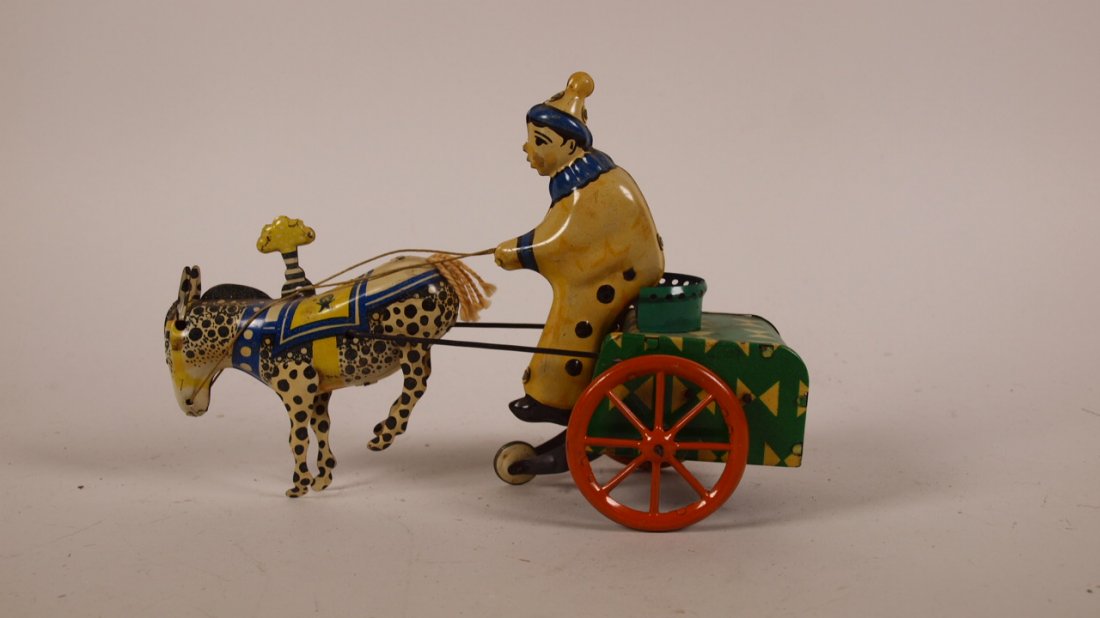Tin litho wind up toy, donkey with clown cart: Tin litho wind up toy, donkey with clown cart