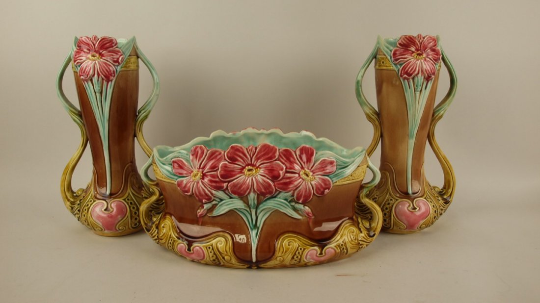 Majolica Frie Onnaing 3 pc garniture, hairline repair: Majolica Frie Onnaing 3 pc garniture, hairline repair to center piece and one vase, centerpiece 13"w, 6 1/2"h, vases 11 1/2"