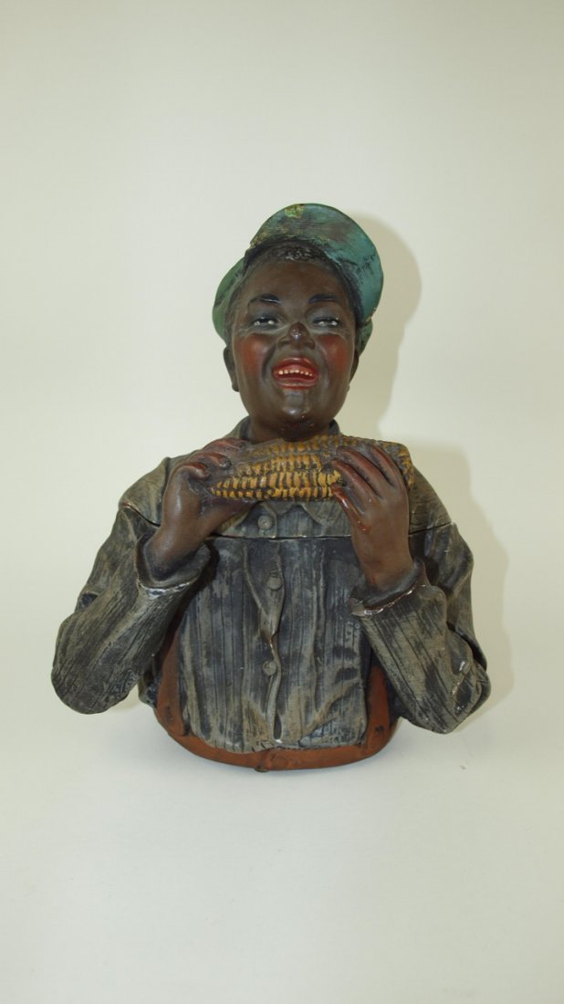 Terra Cotta style humidor tobacco jar in the form of a: Terra Cotta style humidor tobacco jar in the form of a Blackamoor with ear of corn, minor nicks, 10 1/2"
