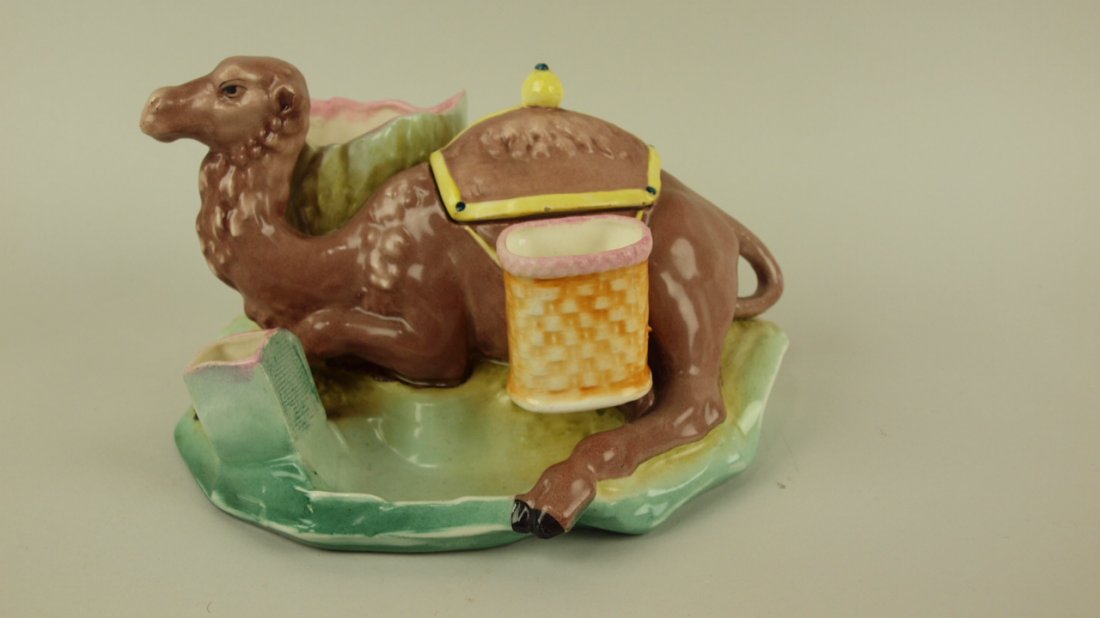 Majolica figural match striker smoking set in the form: Majolica figural match striker smoking set in the form of a reclining camel, 9"