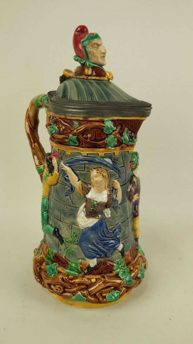 Majolica Minton Tower jug with court jester finial and: Majolica Minton Tower jug with court jester finial and figures in relief