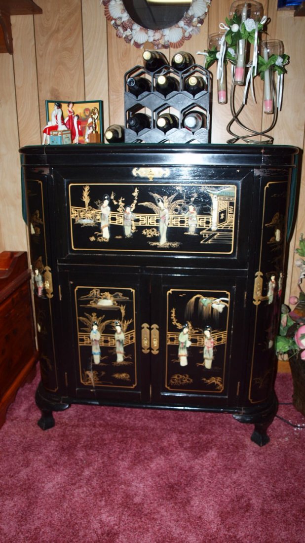 Oriental black lacquered bar cabinet with jade figures: Oriental black lacquered bar cabinet with jade figures 36"w 42"h