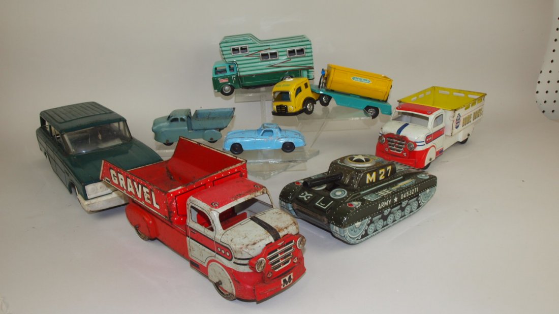 Lot of 8 toy trucks, cars, & tanks Buddy L station: Lot of 8 toy trucks, cars, & tanks Buddy L station wagon, Marx sand & gravel truck, Cragton tin function motor home, TootsieToy Mercedes, Wyandotte truck Japan tin friction toy, Marx HOme Dairy truck,