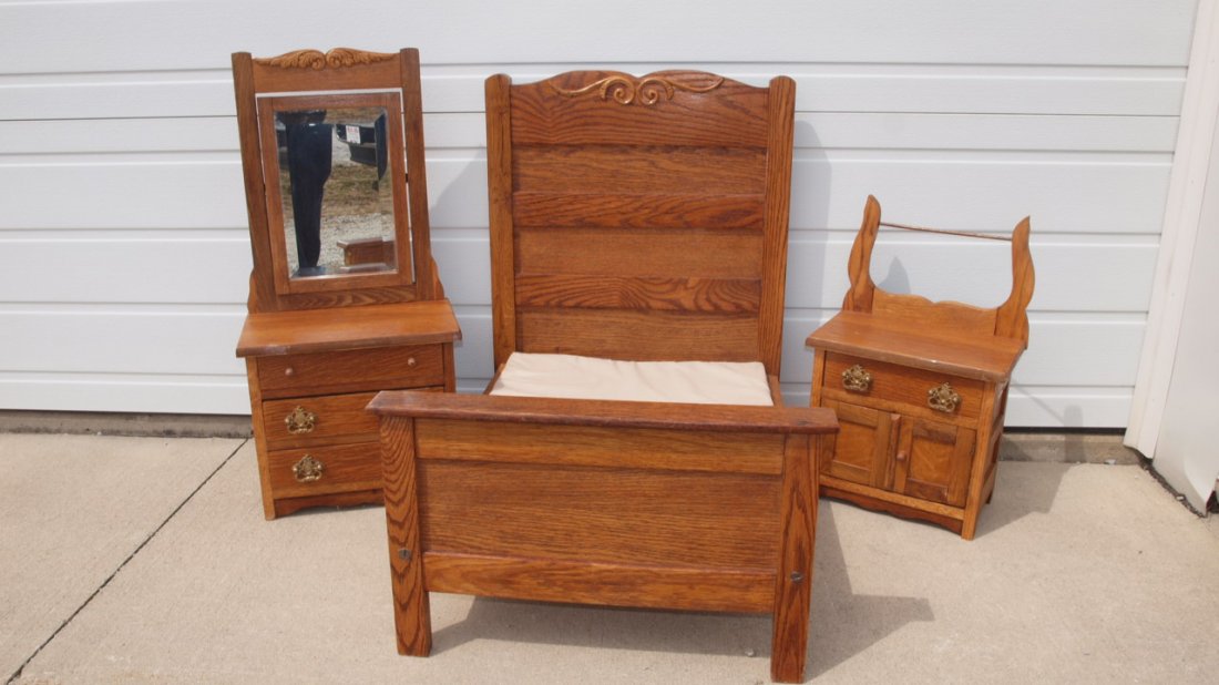 Oak 3 piece doll bedroom suite with high back bed (29': Oak 3 piece doll bedroom suite with high back bed (29' h x 22" w), dresser with beveled mirror (31" h x 15' w), and commode with towel bar (20" h x 13" w)