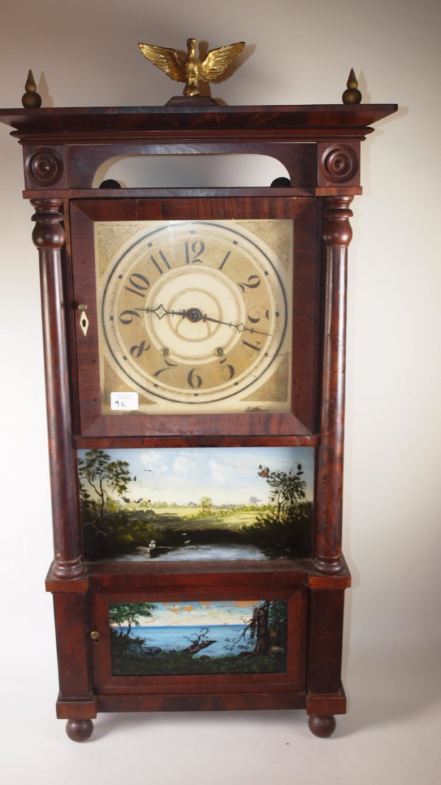 Eli Terry triple decker mantle clock with reverse paint: Eli Terry triple decker mantle clock with reverse paint (some losses) circa 1780, with eagle finish 39"h