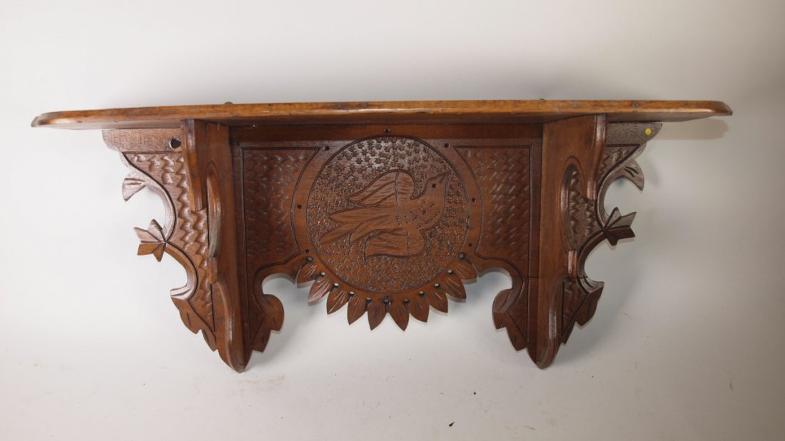 Walnut Victorian clock shelf with carved bird, 25"w: Walnut Victorian clock shelf with carved bird, 25"w