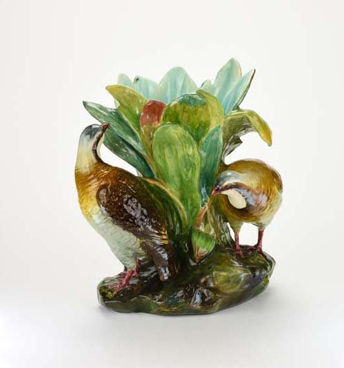 A Very Rare Jerome Massier Majolica ‘Grouse’ Planter: A Very Rare Jerome Massier Majolica ‘Grouse’ Planter c.1888 Shape no. 1318. Modelled as two grouse around a flared flower holder of large green leaves and all on a earthy pedestal base, 12" Catalo