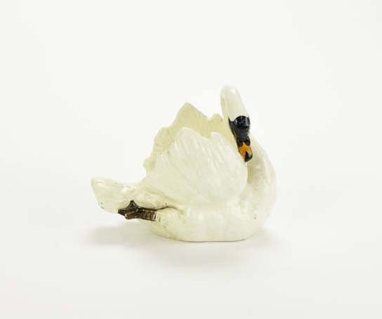 A Small Delphin Massier Majolica Swan Posey Holder c.: A Small Delphin Massier Majolica Swan Posey Holder c. 1880. Modelled as a swan with an open back to form the flower holder, 7" Catalogued and curated by Nicolaus Boston