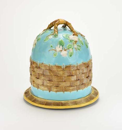 A George Jones Majolica Full Stilton ‘Apple Blossom’: A George Jones Majolica Full Stilton ‘Apple Blossom’ Cheese Keeper. c.1875. The turquoise ground domed lid decorated with a broad band of brown Blossom' Cheese Keeper c.1875. The turquoise ground 