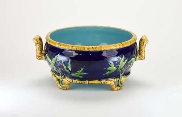 A Rare Minton Majolica ‘Bamboo’ Bowl c.1875 Modelled as: A Rare Minton Majolica ‘Bamboo’ Bowl c.1875 Modelled as an oval cobalt blue ground bowl trimmed with bright yellow bamboo and all supported with bamboo feet, 12"w, 5"h Catalogued and curated by Ni