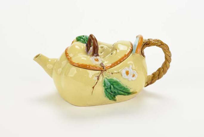 An Extremely Rare Brownfield Majolica ‘ Face and : An Extremely Rare Brownfield Majolica ‘ Face and Pigtail’ Teapot and Cover c.1875 One of two known. Modelled as the face of a Chinaman, pig tail forming the handle, the body decorated with prunus 