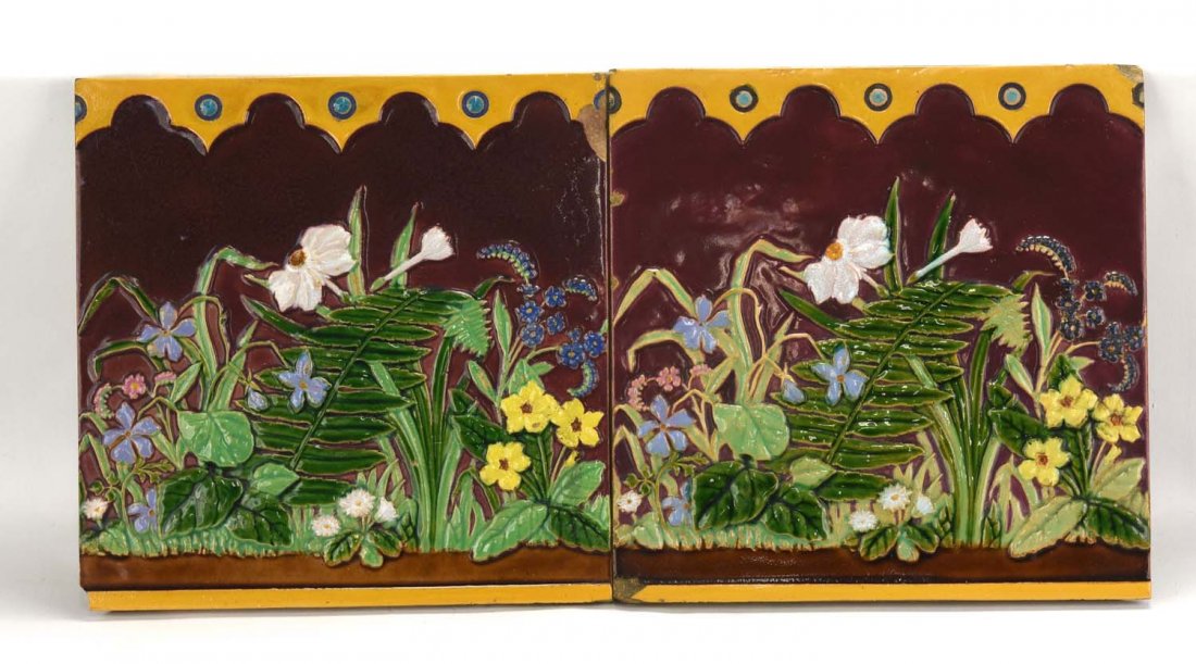 Minton pair of 8" majolica tiles with burgandy ground: Minton pair of 8" majolica tiles with burgandy ground decorated with flowers and ferns, chips