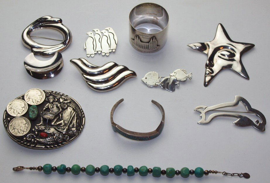 Sterling silver lot of brooches, sterling napkin ring, (1 of 1)