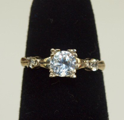 Gold and diamond solitaire .50 ct with 2- .05ct side: Gold and diamond solitaire .50 ct with 2- .05ct side diamonds