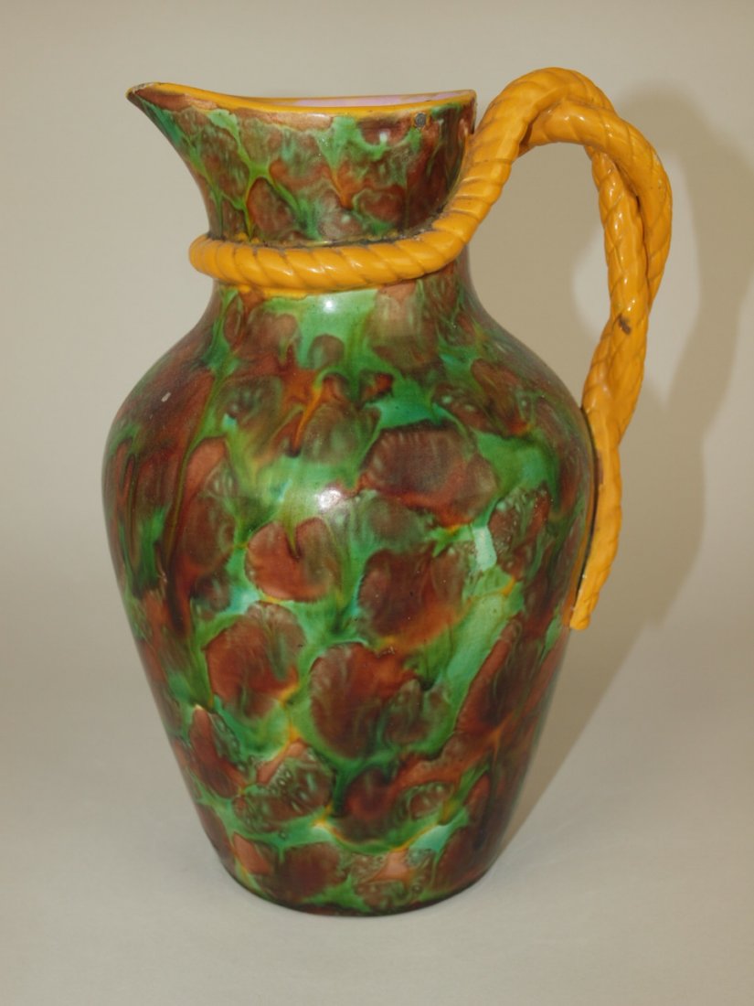 George Jones muttled Majolica jug with yellow rope: George Jones muttled Majolica jug with yellow rope handle, 8 1/2"