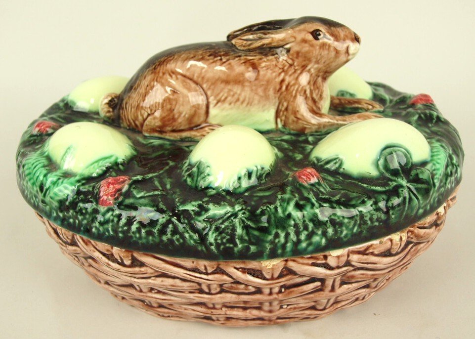 Continental Majolica game dish with rabbit and eggs on: Continental Majolica game dish with rabbit and eggs on cover with basket base, minor hairline to cover, 9"