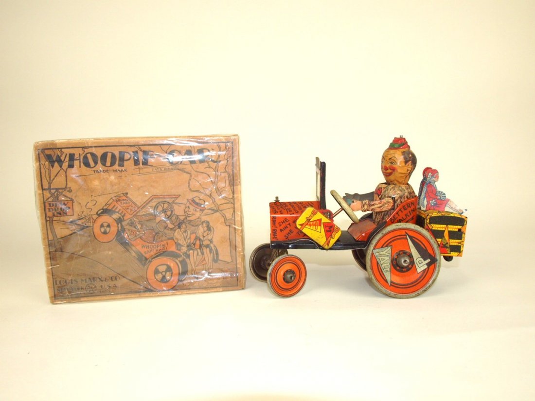 Mary Whoopie Car tin lithograph windup car with (1 of 3)