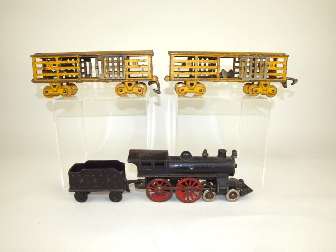 Cast iron floor train with engine, tender, and 2 cattle (1 of 1)