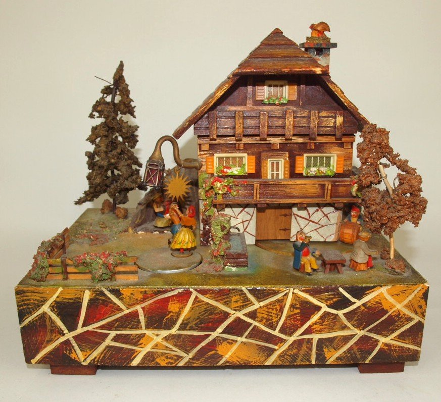 Early swiss cottage mechanical music box with moving (1 of 4)