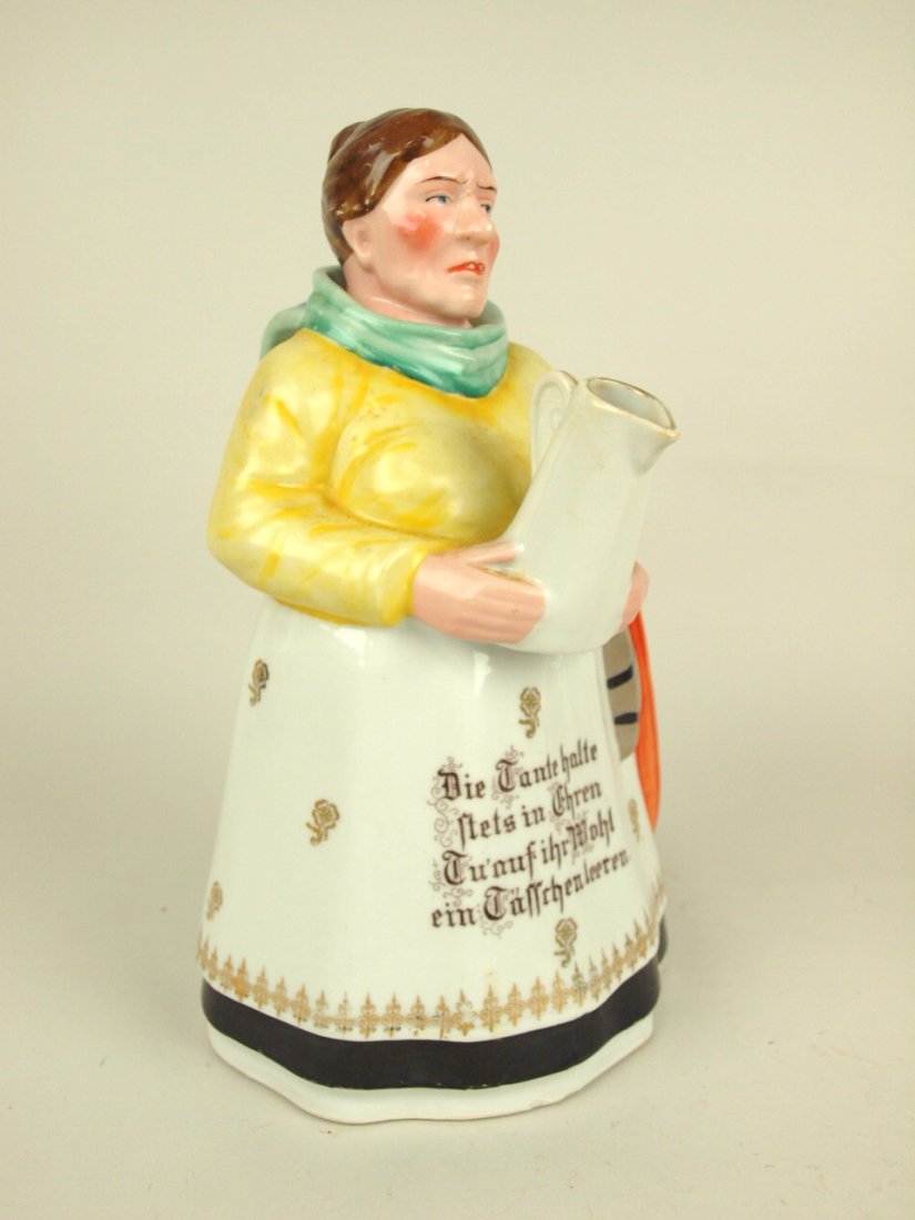 Porcelain figural coffee pot in the form of a lady with (1 of 2)