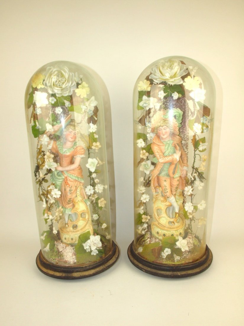 Pair of early bisque figures of man and woman in glass (1 of 1)