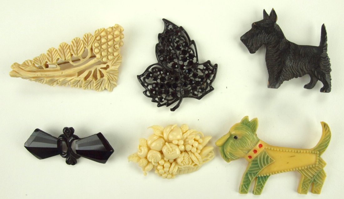 Lotof 6 celluloid & other figural brooches (1 of 1)