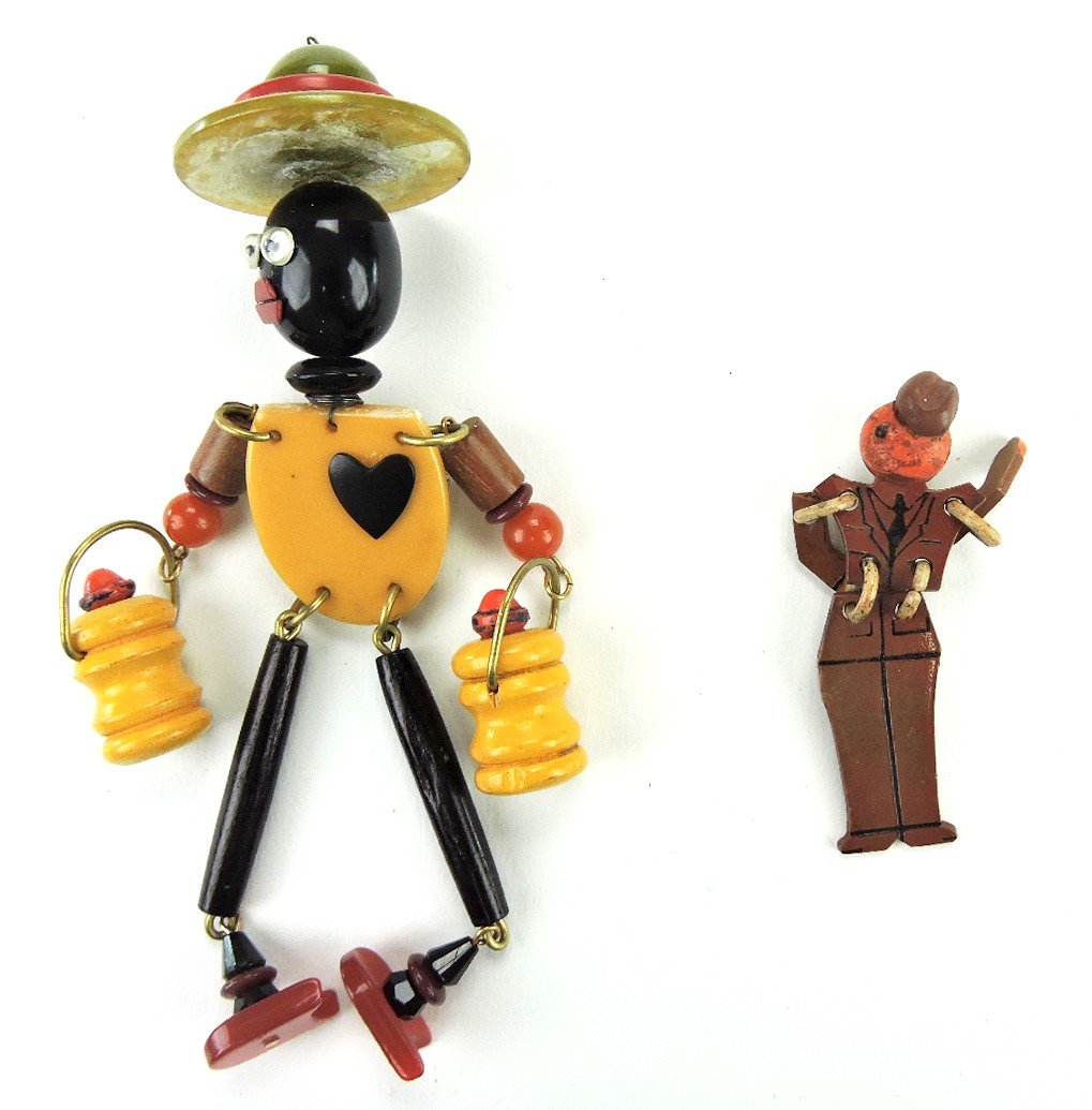 Bakelite luggage tag of Blackamore and small soldier: Bakelite luggage tag of Blackamore and small soldier brooch
