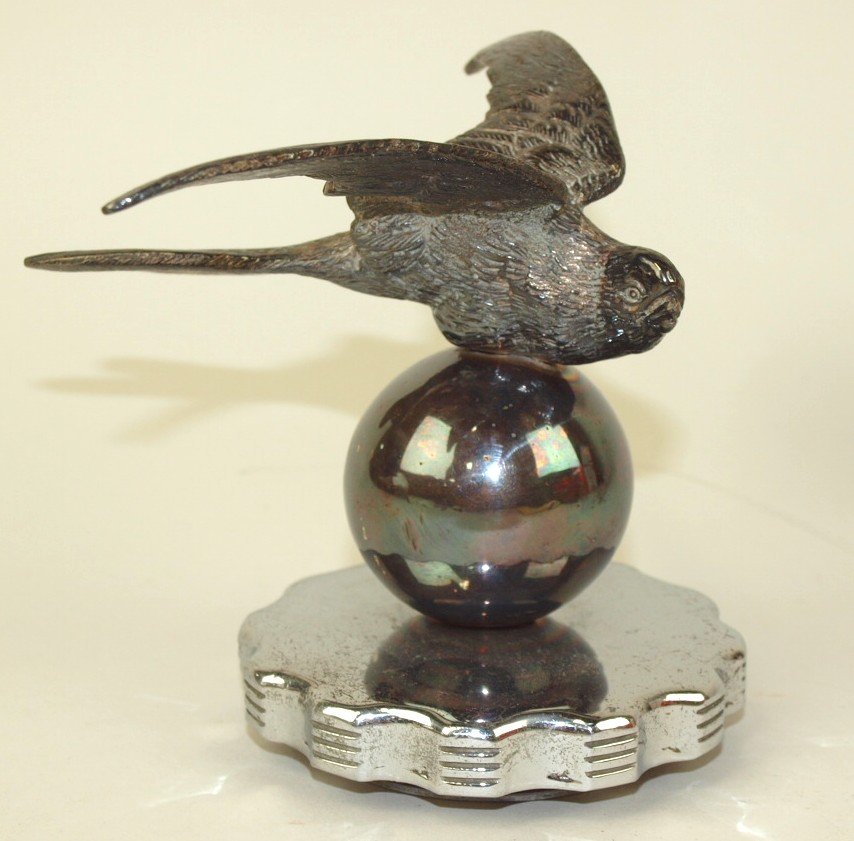Swift on globe hood ornament radiator cap, 4 3/4" (1 of 1)