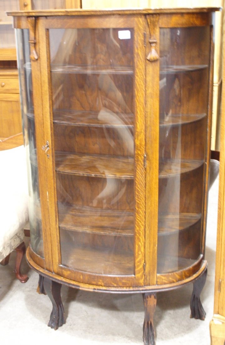 Oak triple curved glass china cabinet, 56"h, 36"w: Oak triple curved glass china cabinet, 56"h, 36"w plexiglass door