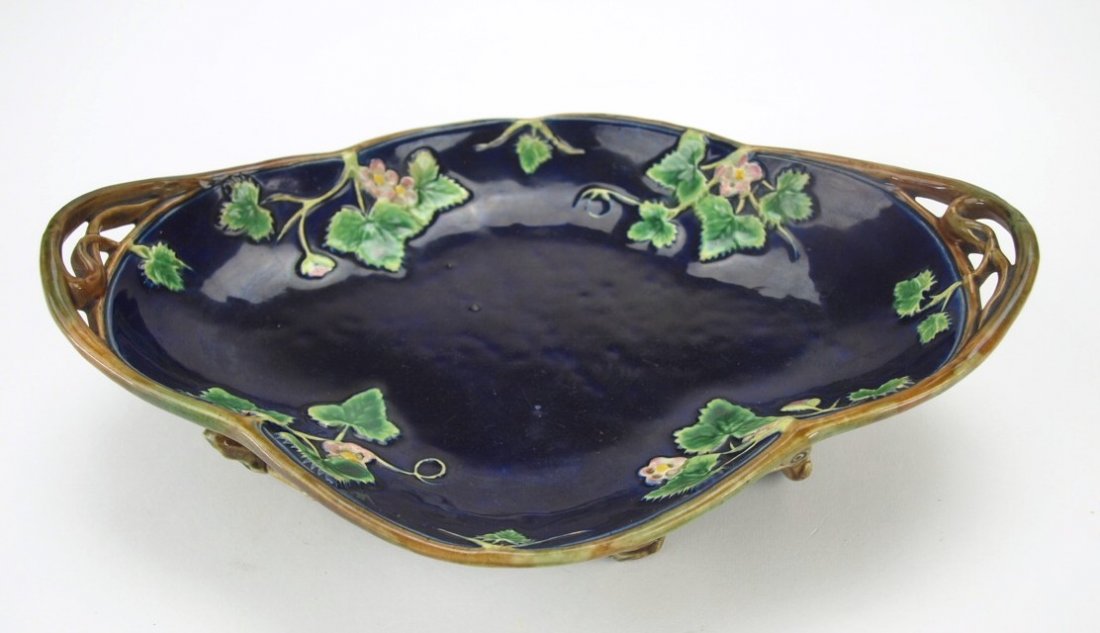 George Jones majolica cobalt oval bowl with vine: George Jones majolica cobalt oval bowl with vine handles and feet, strawberry blossom motif, 10 1/2"