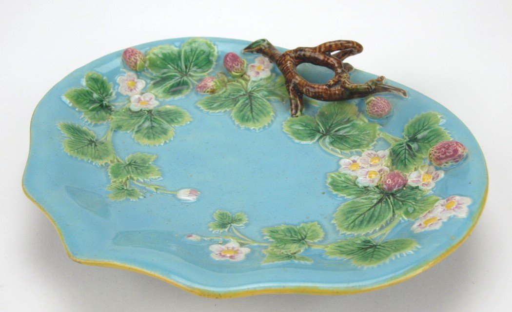George Jones majolica strawberry tray with twig handle: George Jones majolica strawberry tray with twig handle (lacking bird), handle restored, 10"
