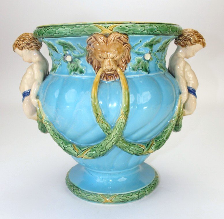 Minton majolica wine cooler with putti handles and: Minton majolica wine cooler with putti handles and laurel swags, old restoration, 10 1/2"