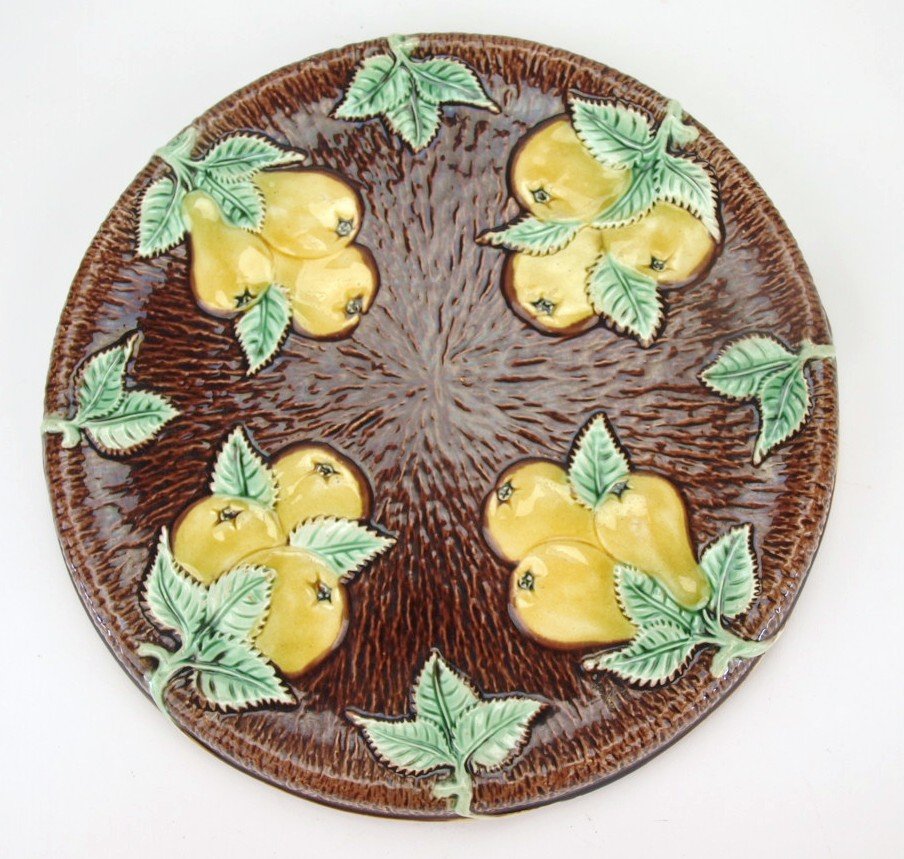 Majolica pear and apple 11" trivet, rim chip: Majolica pear and apple 11" trivet, rim chip