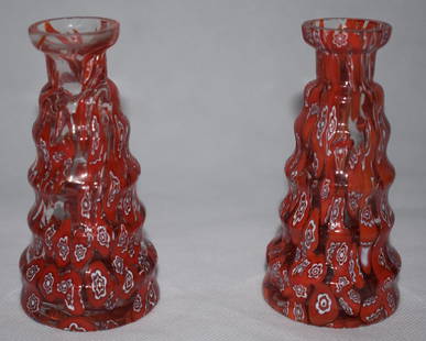 2x Murano Millefiori Vases | 1920s: Pair of Millefiori vases from the early 20th century. Description Stepped, connical vases with red and white Millefiori canes on clear glass. Dimensions H: 10.5cm Diameter: 4.5cm This item can