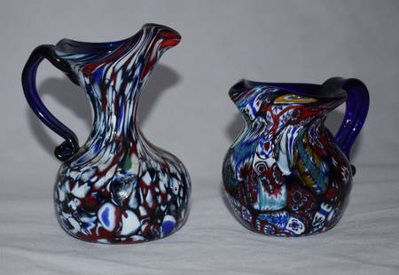 2x Murano jugs | Millefiori |70s: 2x Murano jugs Millefiori from 70s Hand blown glass jugs with millefiori. Dimensions Jug left Height: 20.0 cm Jug right Height:8.5cm Shipping This vase can be combined for shipping! Austria: 5.50