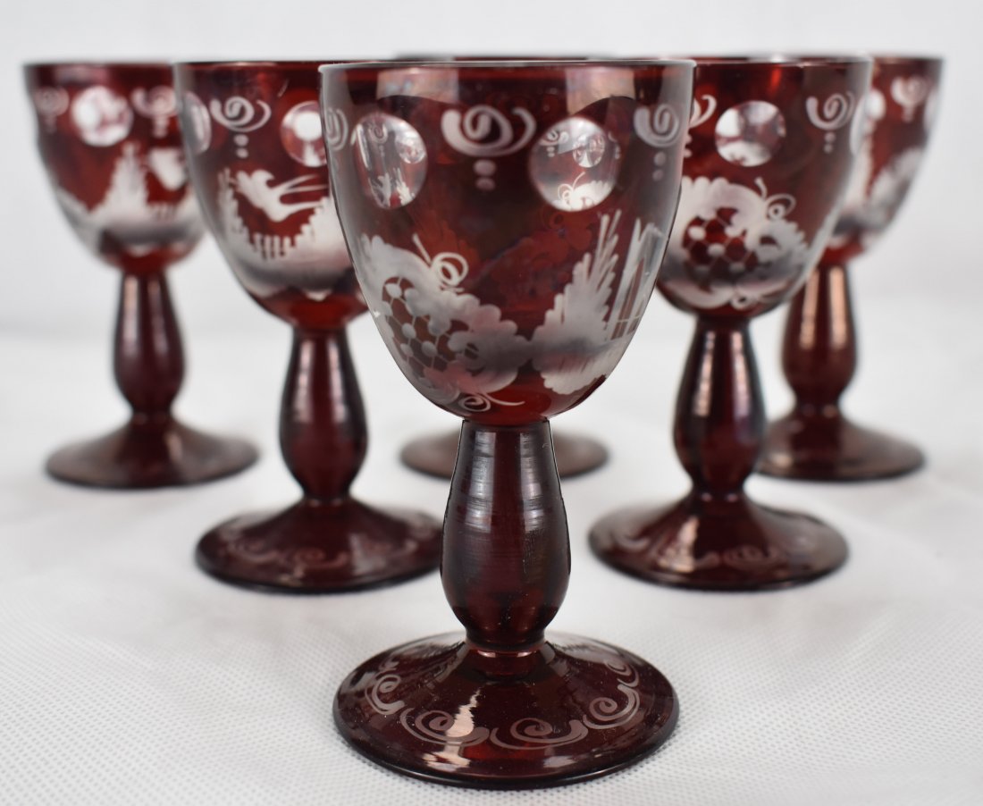 Egermann Liqueur Glasses | Bohmeian Glass | 6 Vessels: Six Vintage Bohemian Ruby Red to Clear Etched/Rinsed Egermann Liquer Glasses. (1950s-80s) Tapered bowl cranberry red acid wash to clear.Pattern depicts a swallow, tower and net pattern. Six clear roun