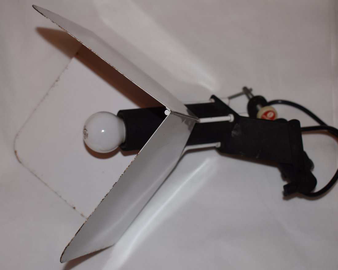 Joe Colombo | Triedro | Clamp | Stilnovo: Triedro clamp lamp designed by Joe Colombo for Stilnovo in 1972 Design: Joe Colombo Execution: Stilnovo Date: 70s Clamp lamp designed by Colombo in 1972. White, lacquered metal diffuser, Black alumini