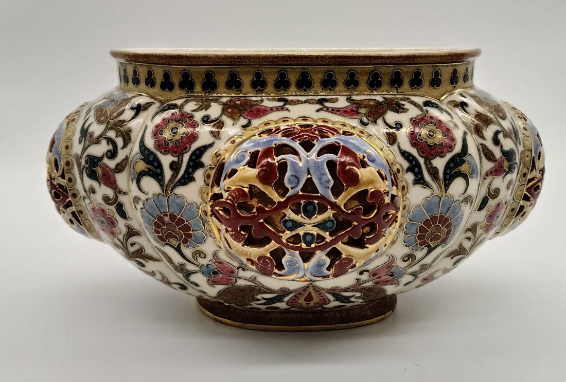 Zsolnay Pecs | Jardiniere | Antique: A Zsolnay Pecs Hungarian pottery oval jardiniere. The walls are modelled with raised, pierced medallions on a ground of arabesque scrolling leaves,Persian/oriental inspired. impressed marks,model 1063