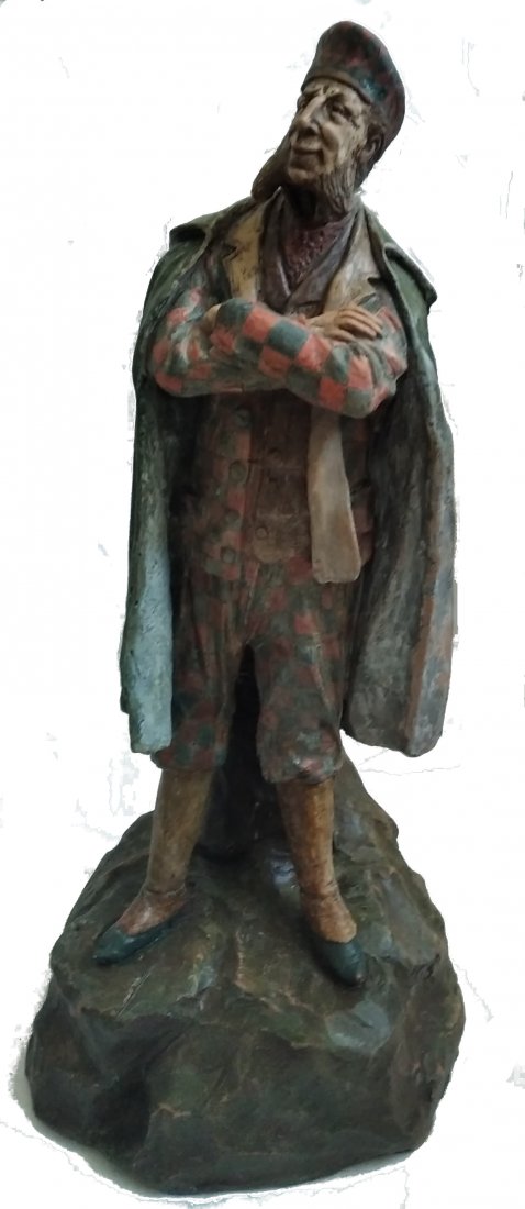Goldscheider | 19th Century | Viennese Man with Cap: Friedrich Goldscheider, Original Painted Earthenware Figure, Vienna, Austria Date:1887/88 Description: Goldscheider, Vienna. A figure of a Viennese gentleman leaning on stones. Earthenware, polychrome